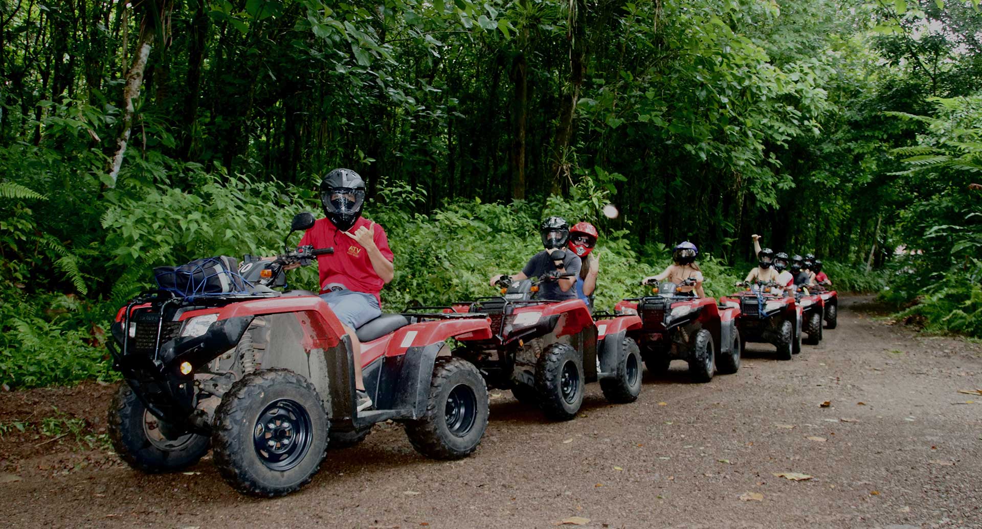 A group of travelers enjoying an exciting Manuel Antonio ATV Tour through the jungle