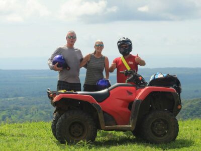 A guide assisting riders during the Manuel Antonio ATV Tour