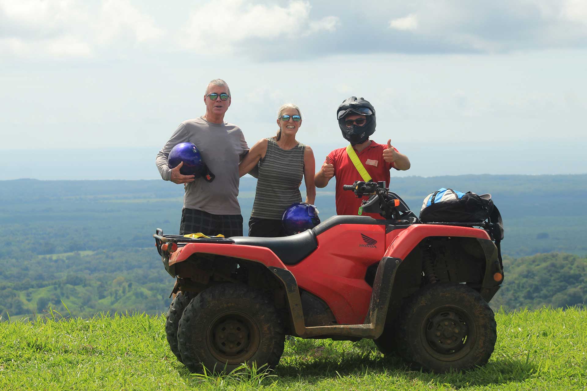 A guide assisting riders during the Manuel Antonio ATV Tour